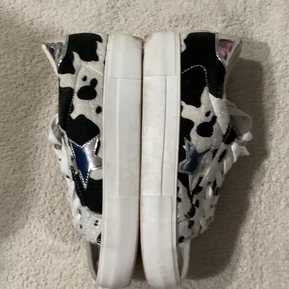 Trendy Black and White Sneakers with Silver Accents